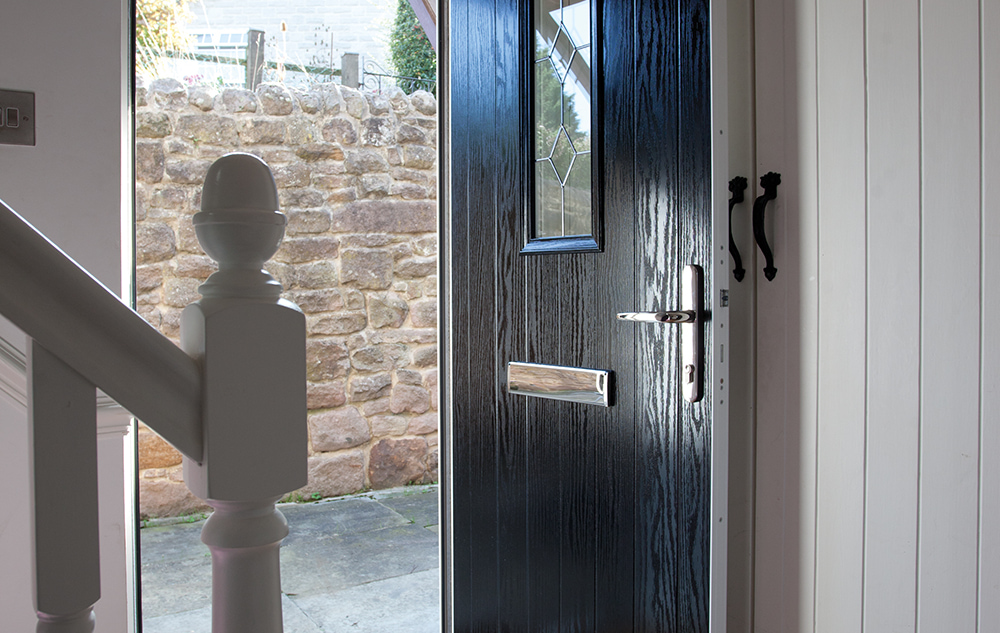Black composite door in white household.